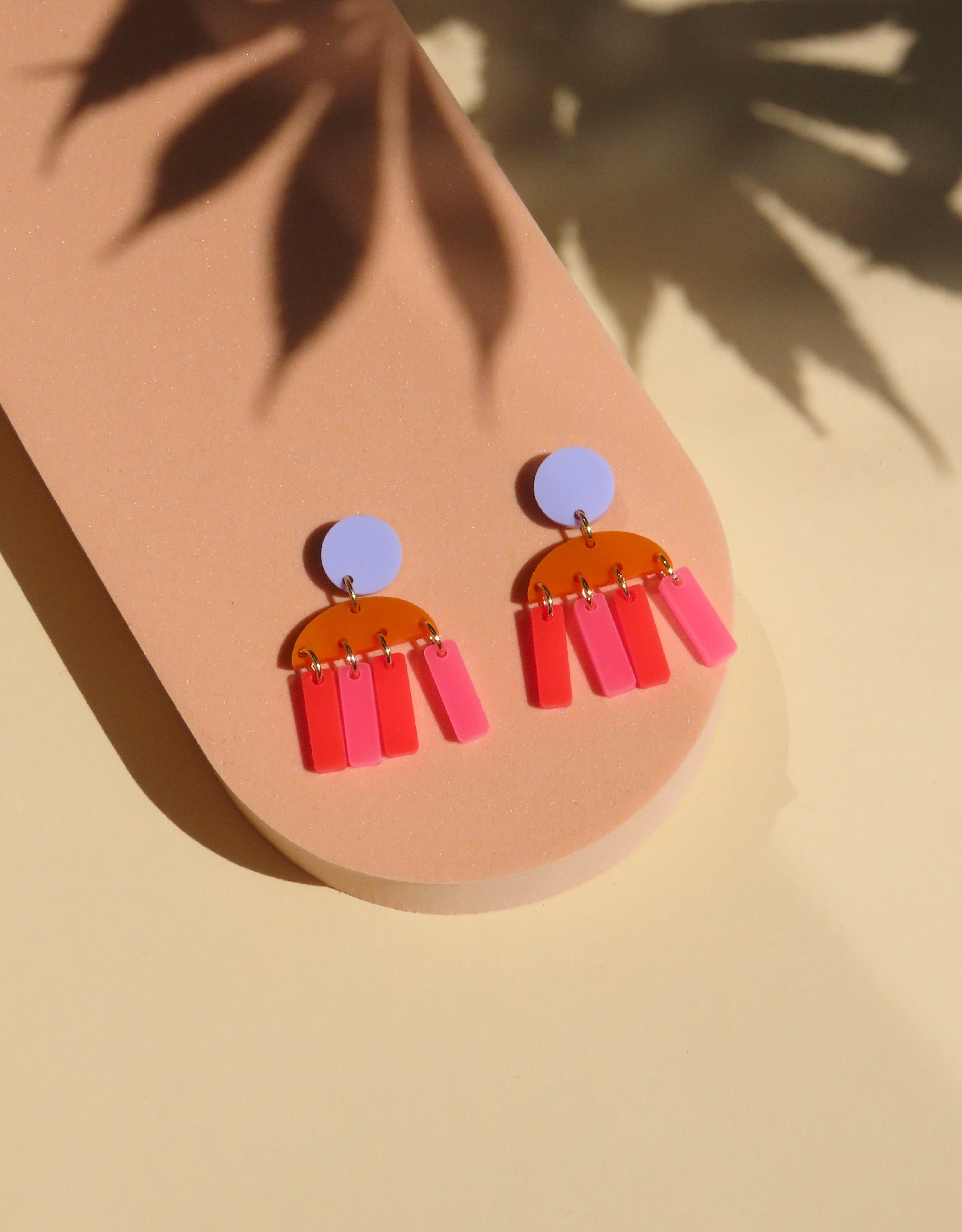Boucles d'oreilles à rayures roses et rouge feu