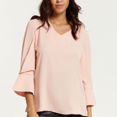 Blusa de manga larga con puños detallados y cuello en V en rosa