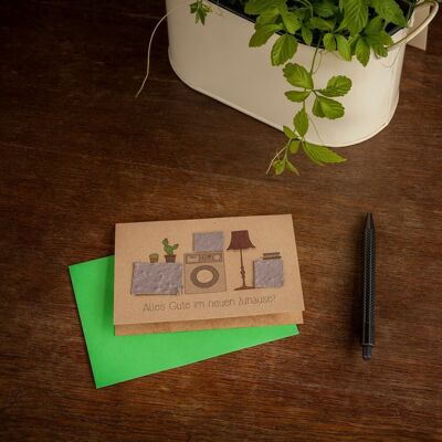 Greeting card - all the best in your new home - cardboard boxes