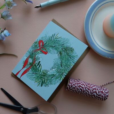 Couronne de carte de Noël avec arc