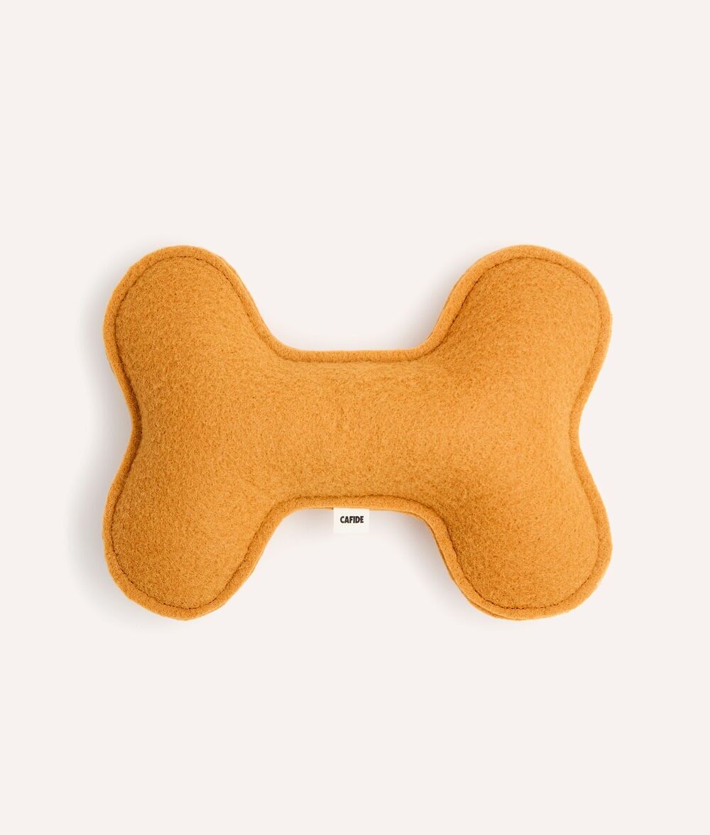 Senffarbenes Hundespielzeug, spielen