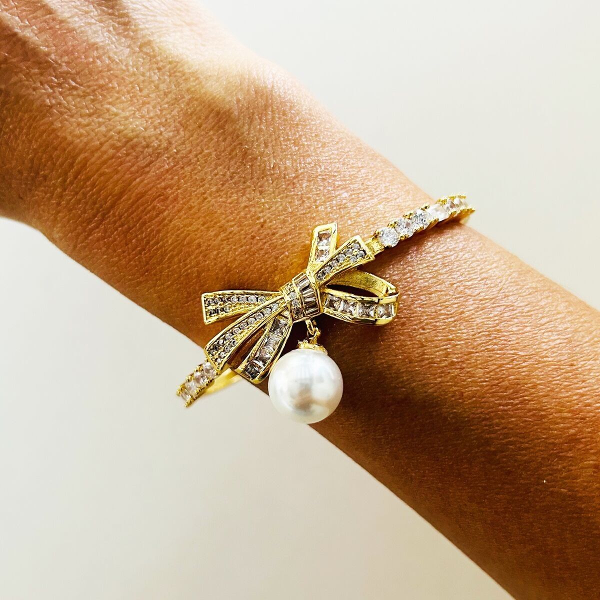 BRACCIALE FIOCCO CON PERLA