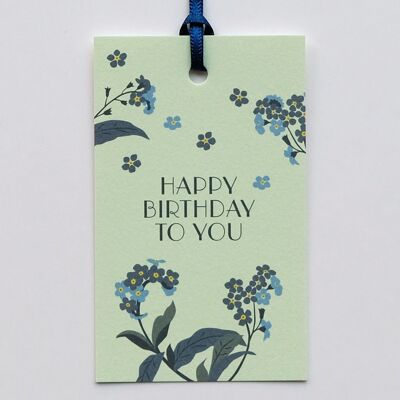 Etiqueta de regalo de feliz cumpleaños con cinta de seda
