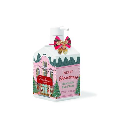 Savon liquide pour les mains dans un distributeur de Noël
