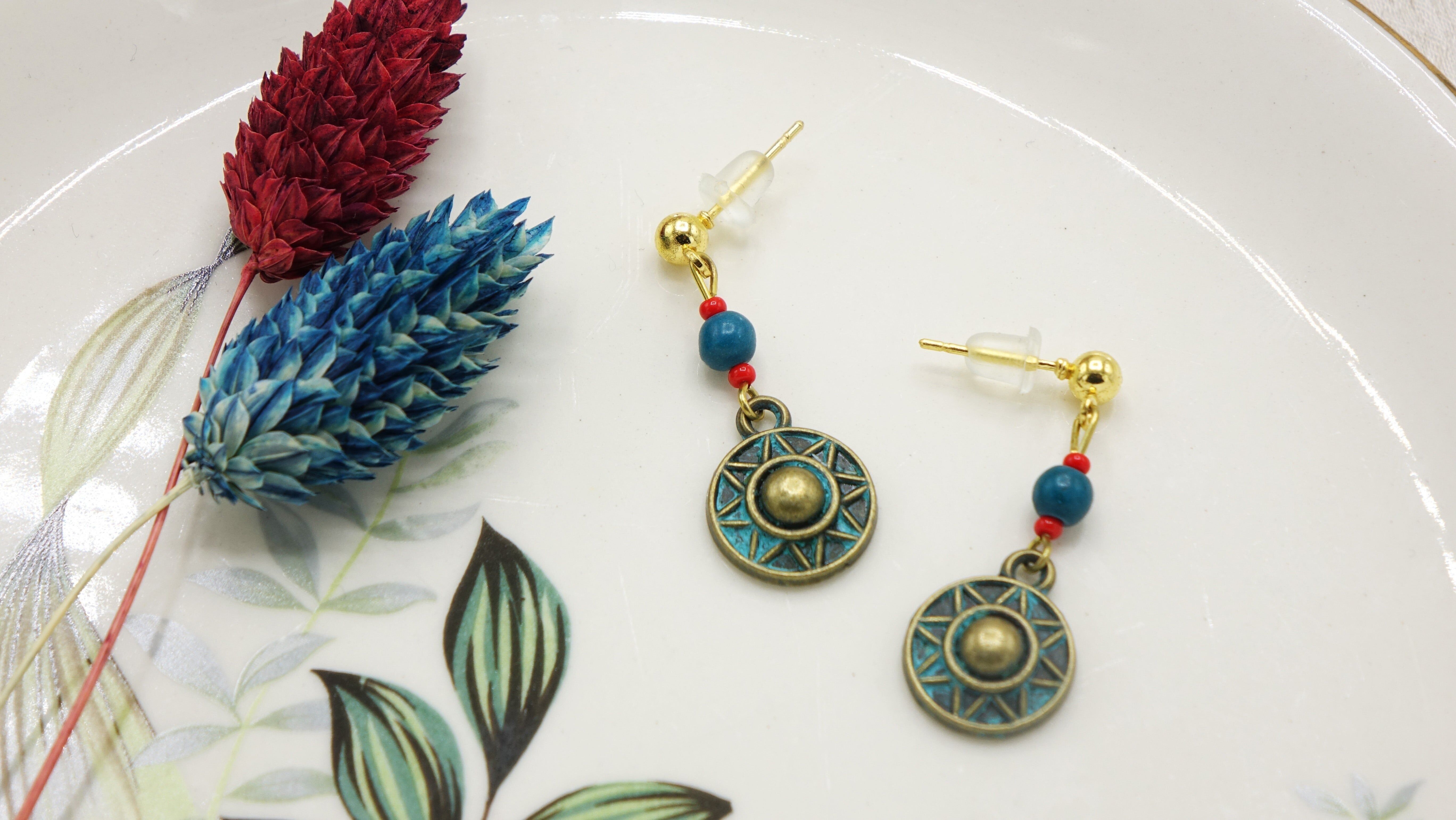 Orecchini con ciondolo a forma di raggio di sole