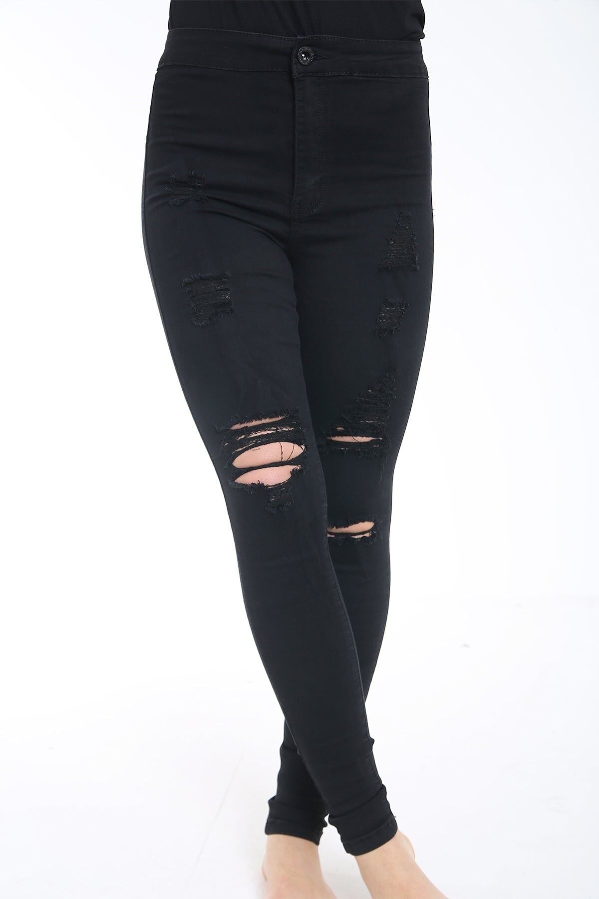 Jeans skinny strappati e rovinati a vita alta