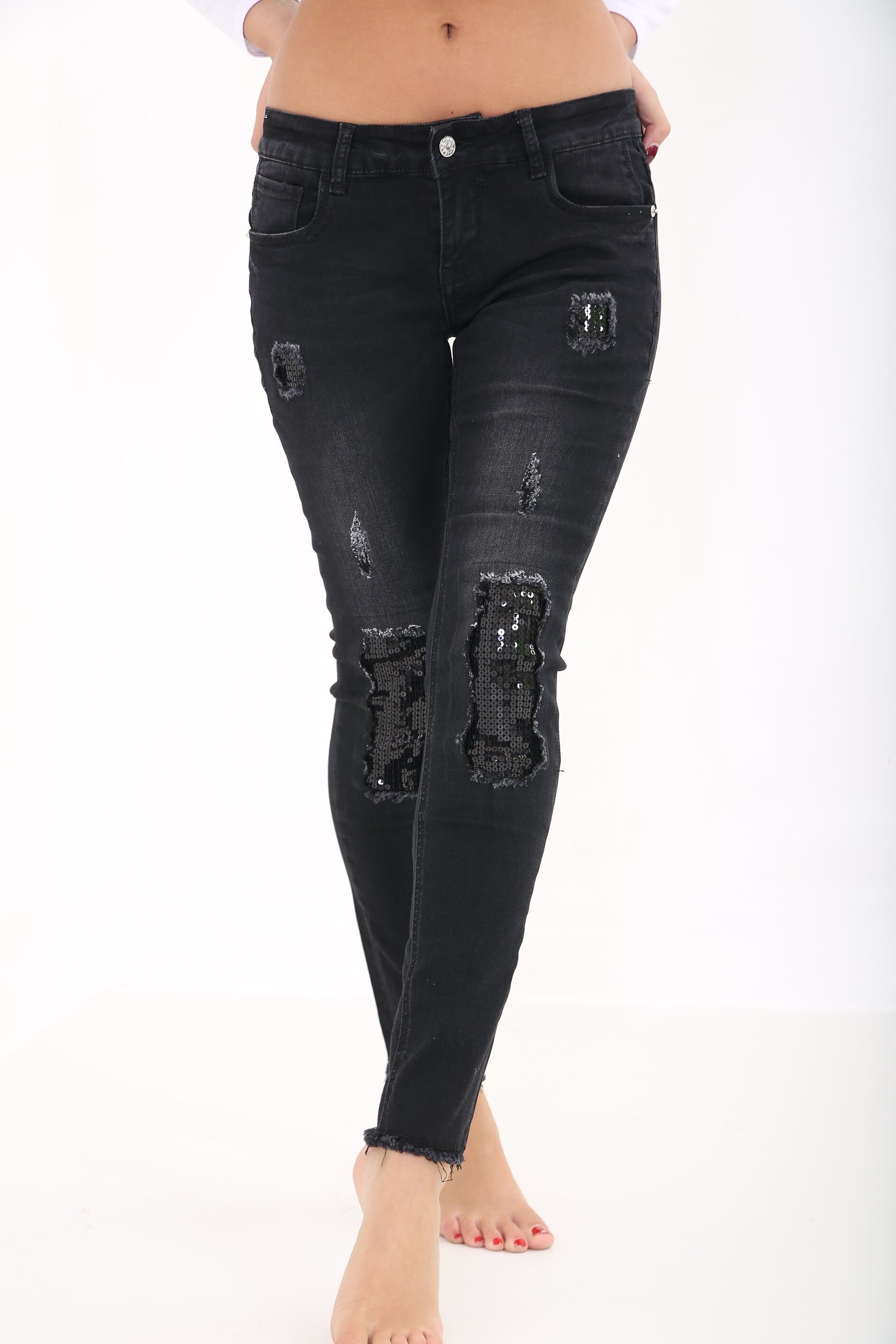 Jeans denim usurati con inserti di paillettes