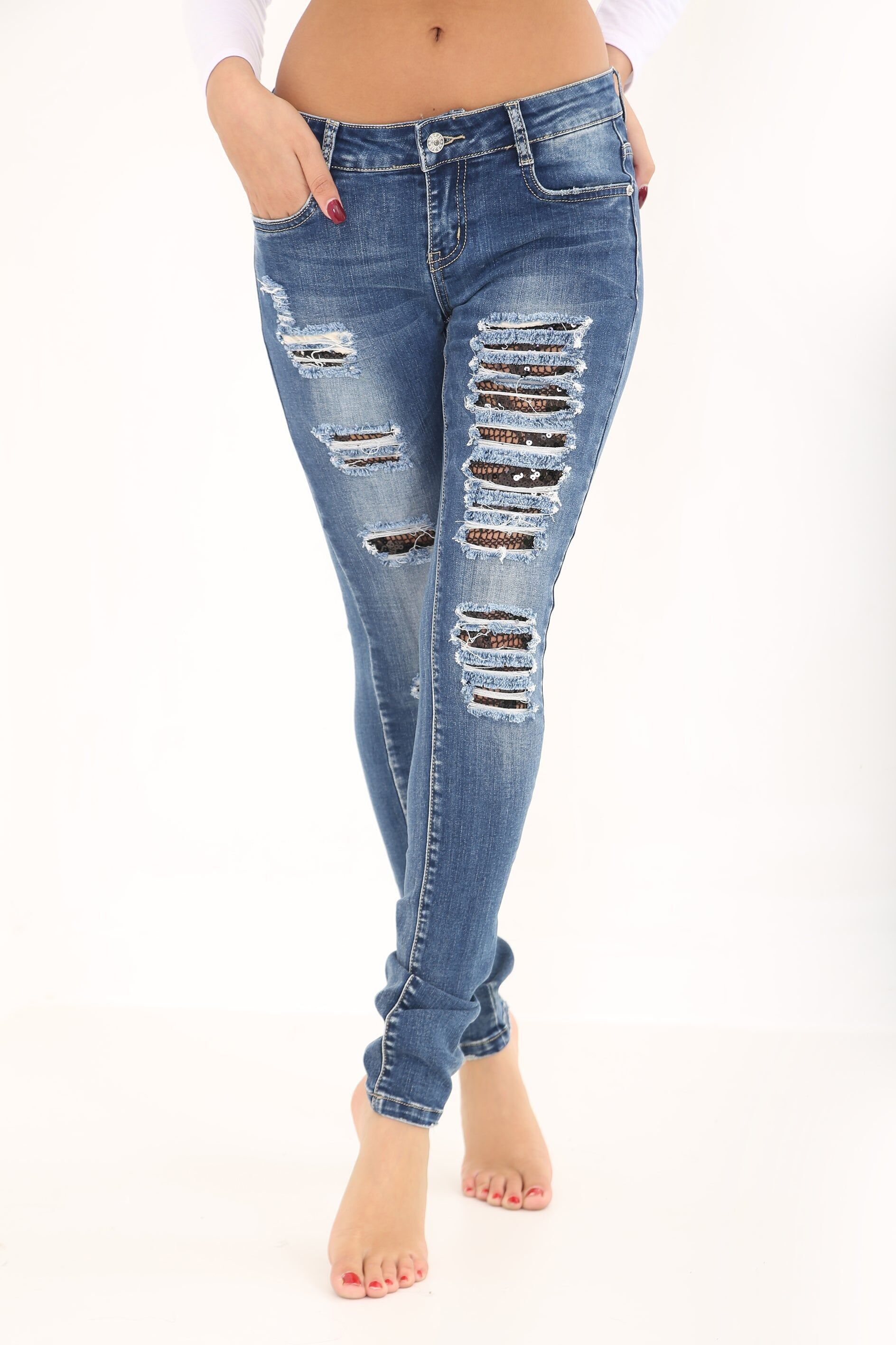 Jeans denim usurati con inserti in paillettes a rete