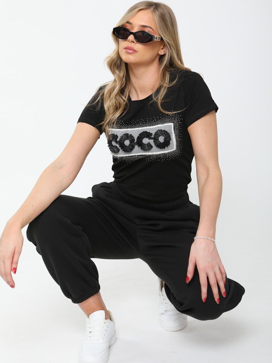 T-shirt con borchie Coco e applicazione in rete