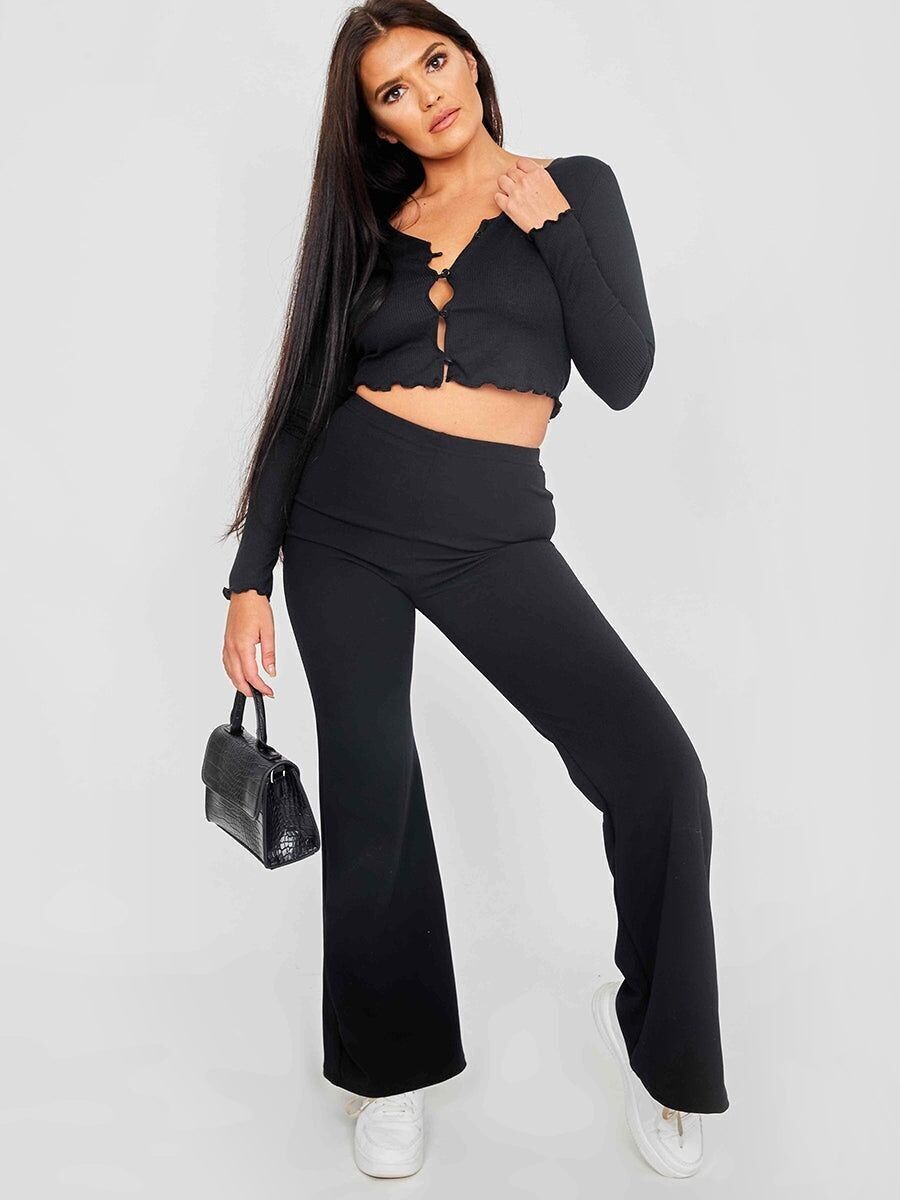 Cardigan corto a coste con bottoni