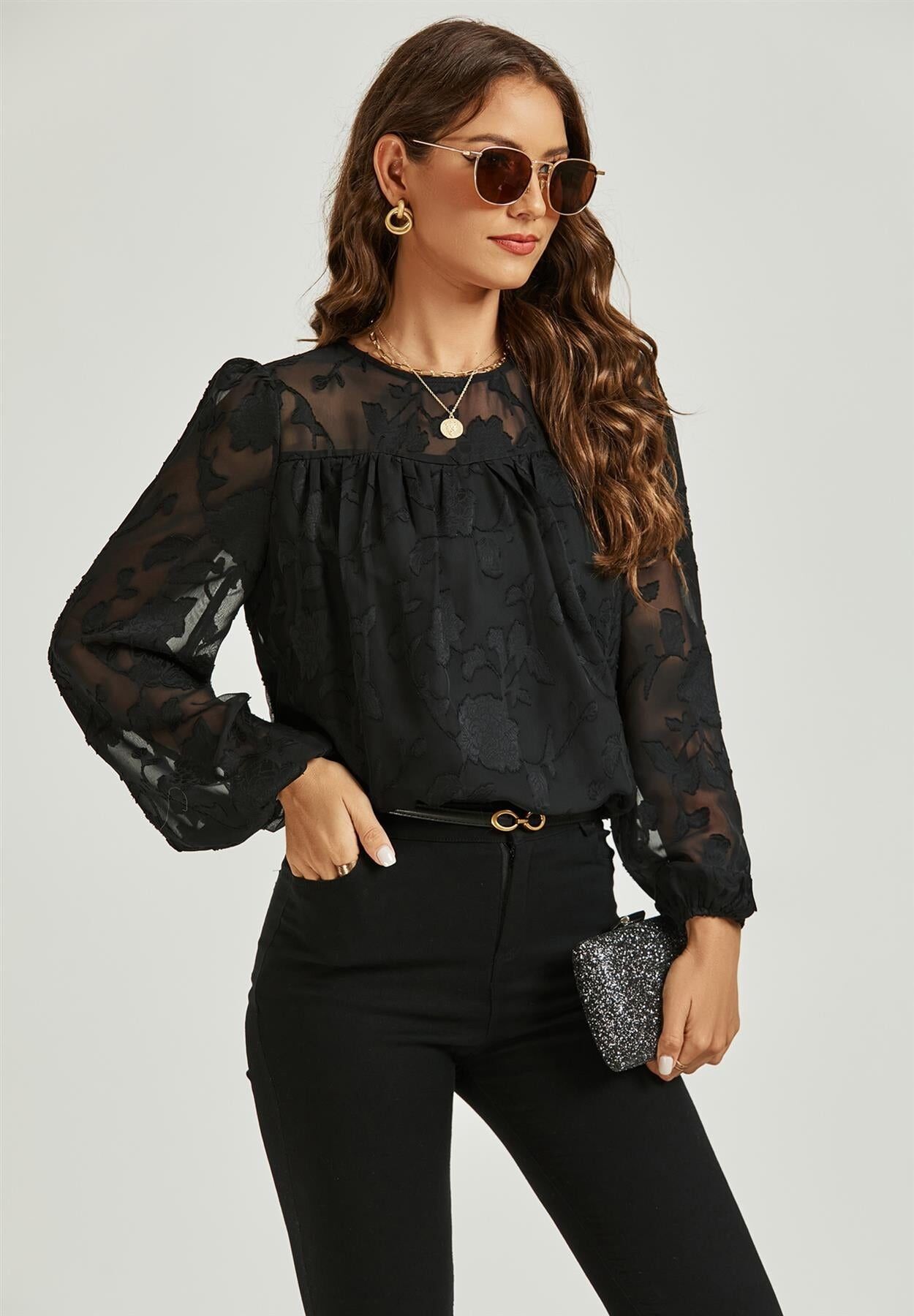 Top in pizzo di tulle floccato a maniche lunghe in nero