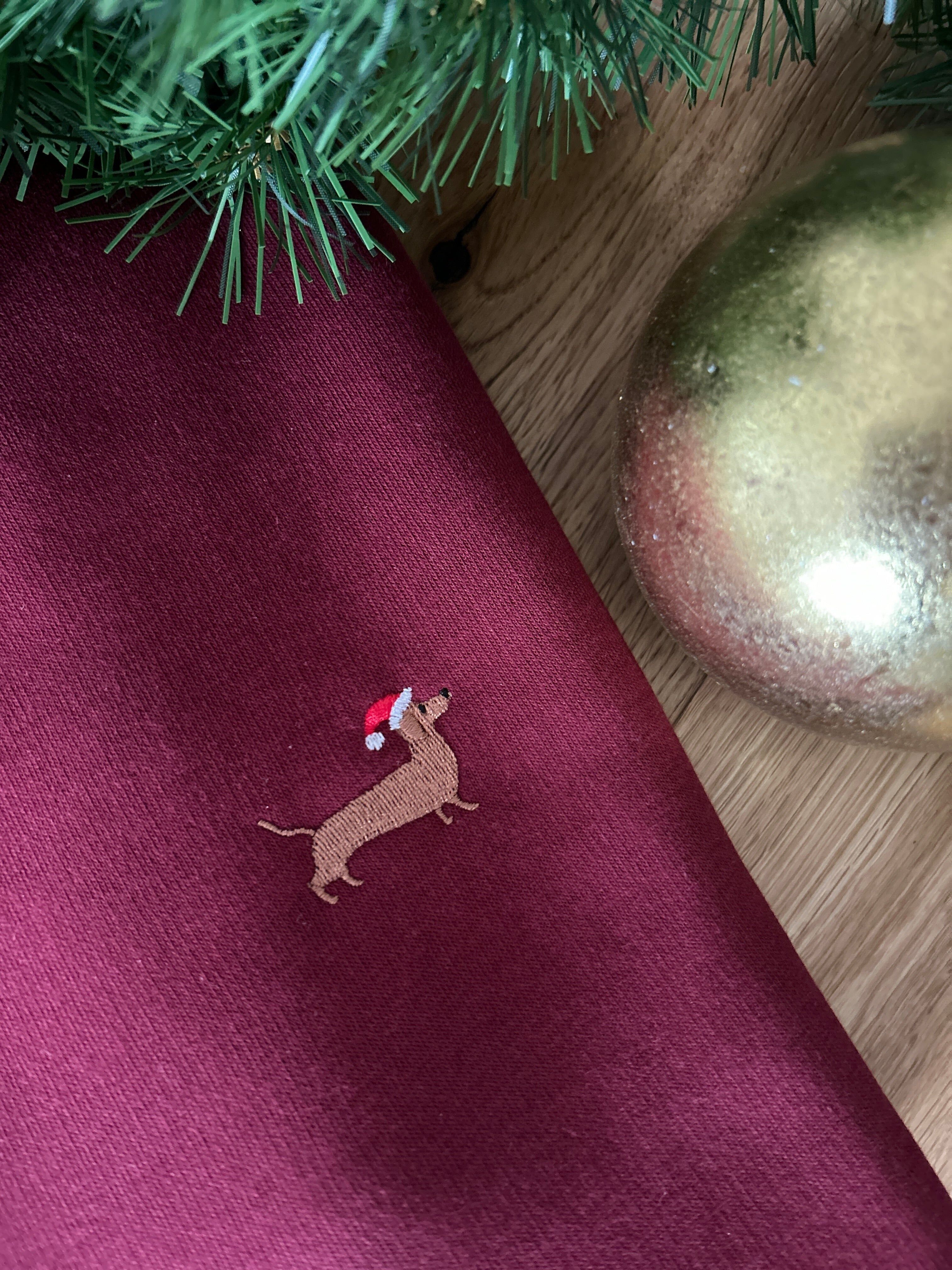 Felpa unisex con ricamo bassotto natalizio