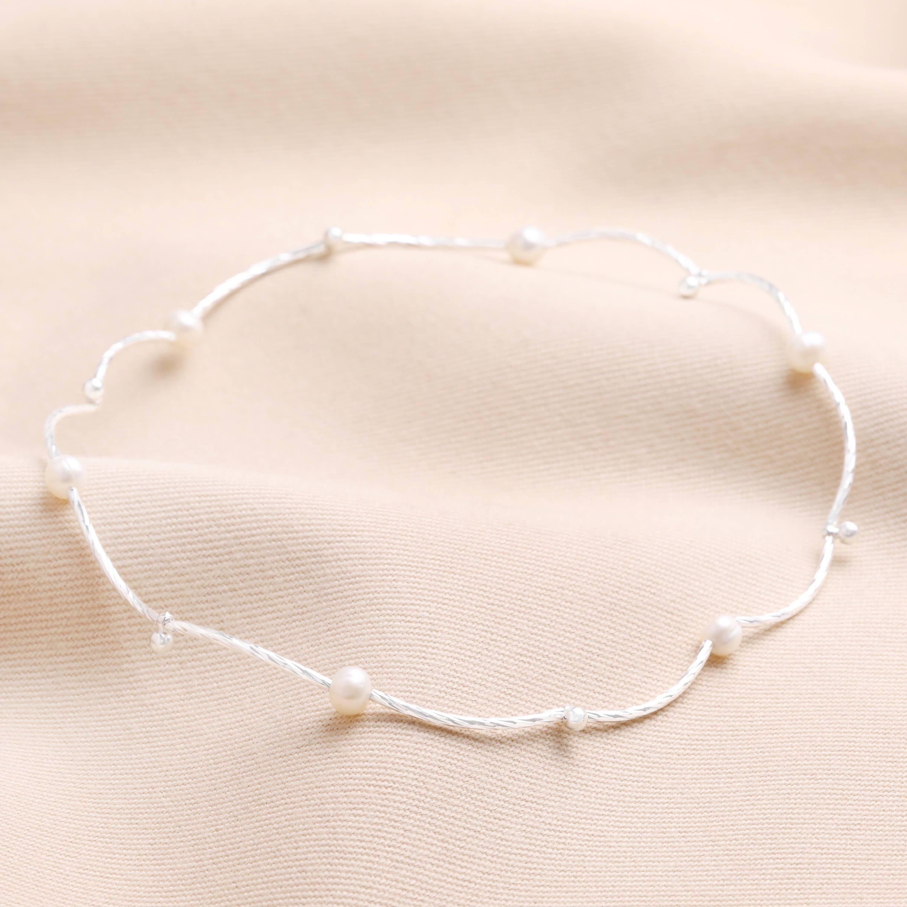 Collana e bracciale bidirezionali in argento con perle d'acqua dolce