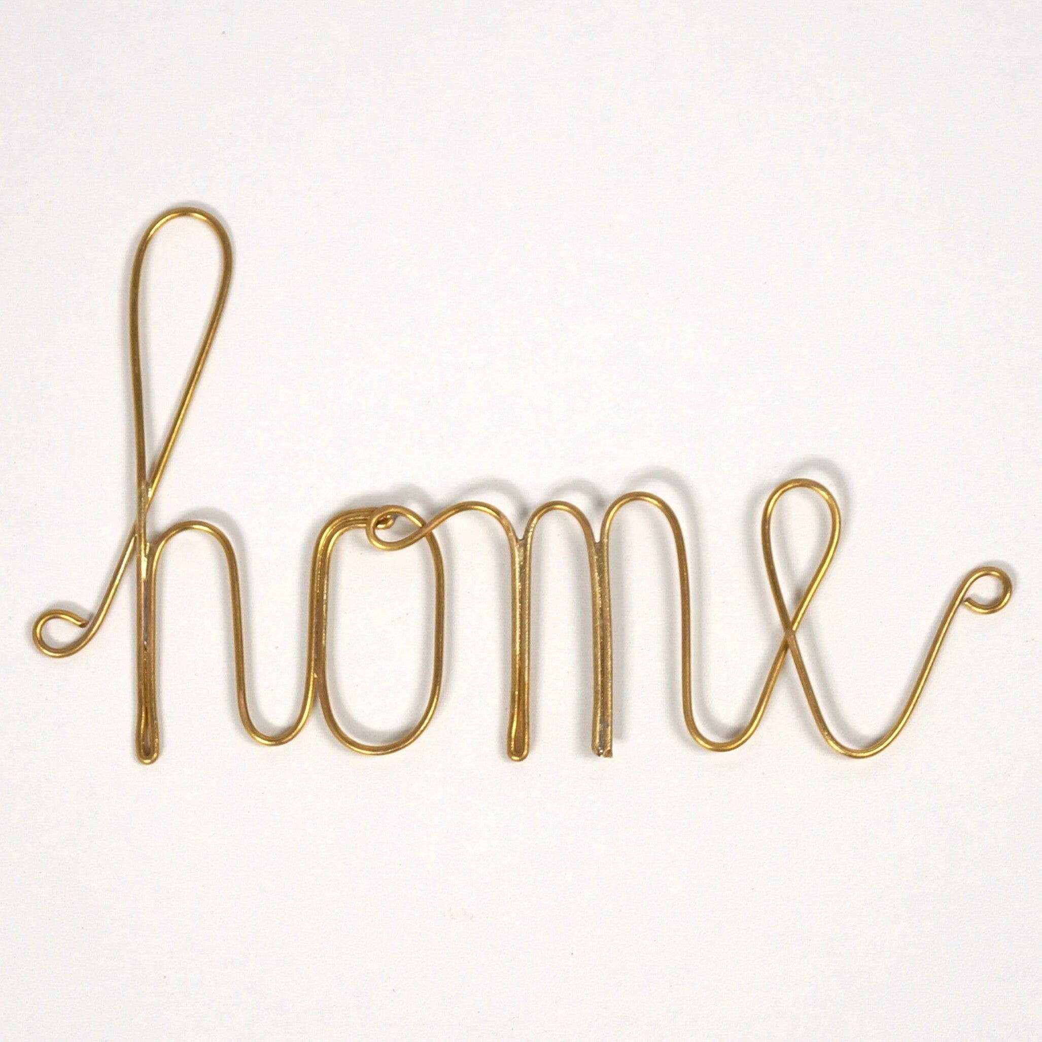 Palabra en latón dorado - hogar