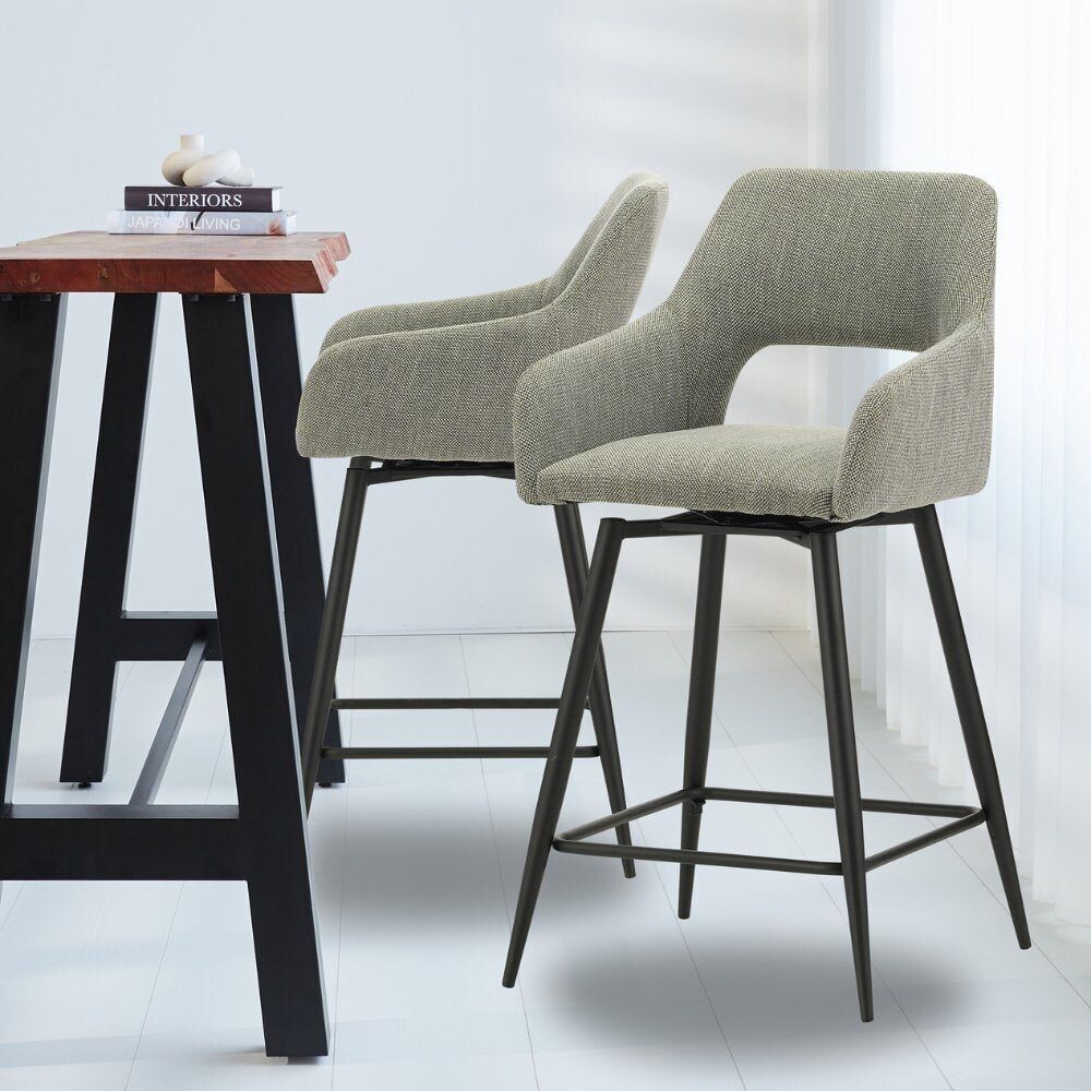 Skye swivel bar stool with green armrest