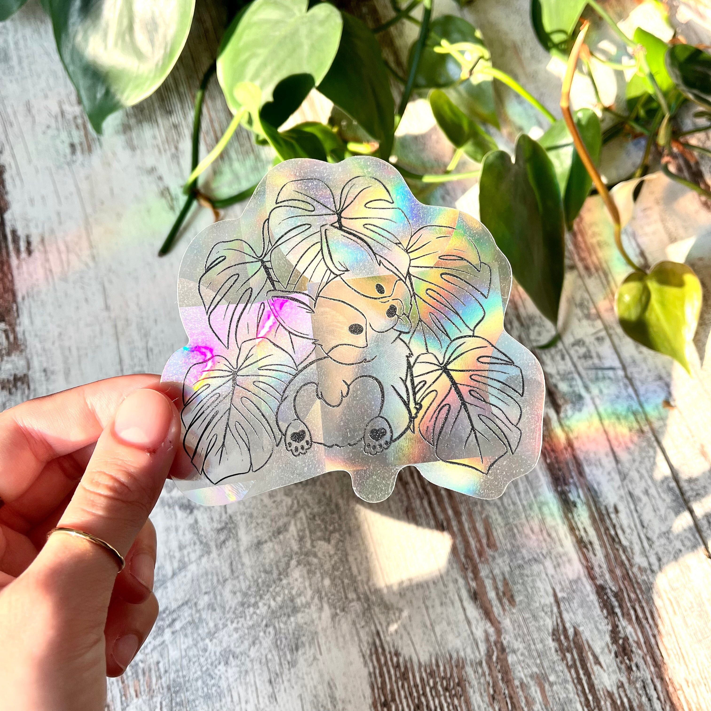Autocollant Sun Catcher - Chien Corgi avec feuilles de Monstera deliciosa