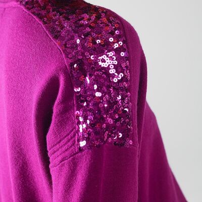 Pull fuchsia à manches longues avec paillettes sur les épaules