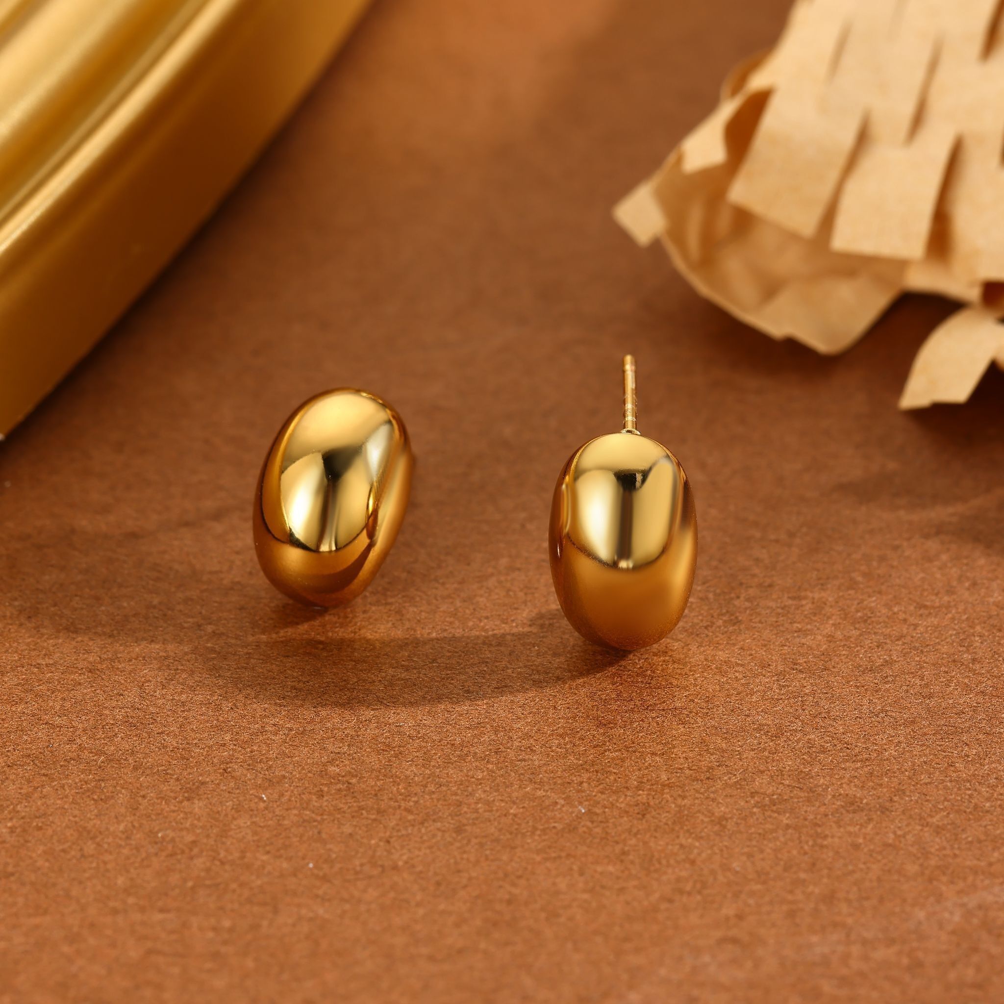 Glänzende, dicke Goldohrstecker
