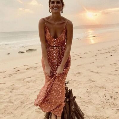 Vestido asimétrico con detalle de volantes y tirantes en color naranja con estampado de lunares