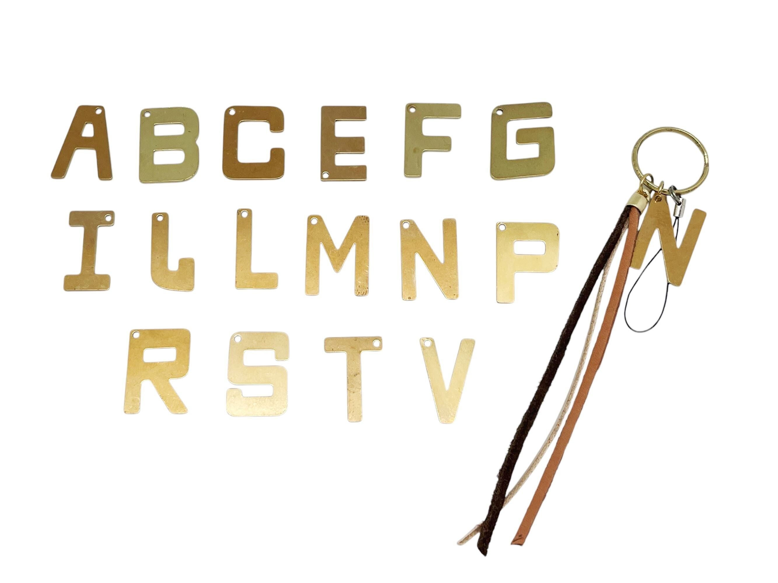 Mobile phone keychain with LETTER in gold and brown leather fringes