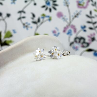 Dainty Silver Flower Stud Earrings with Gold plated centers.