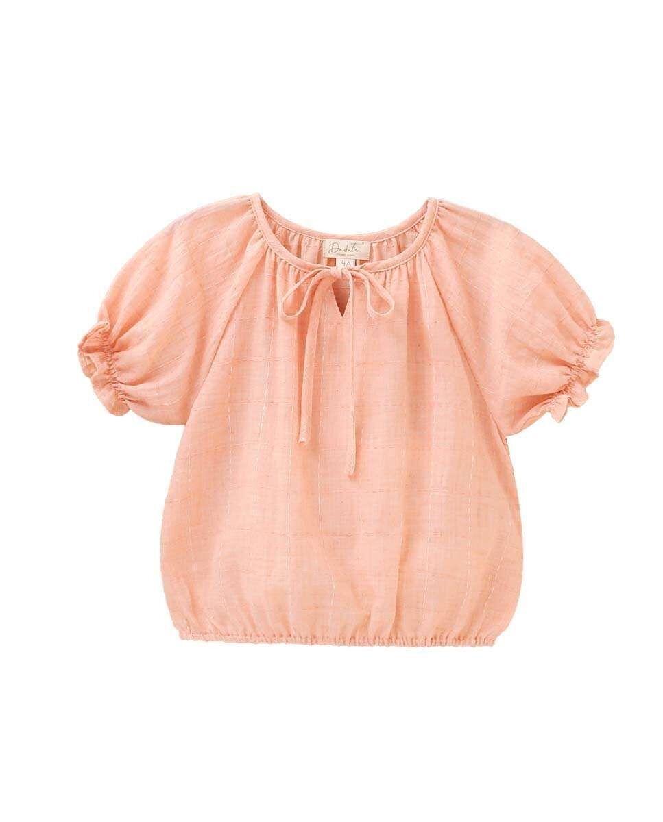Girl's blouse with short puffed sleeves and bow on the neck