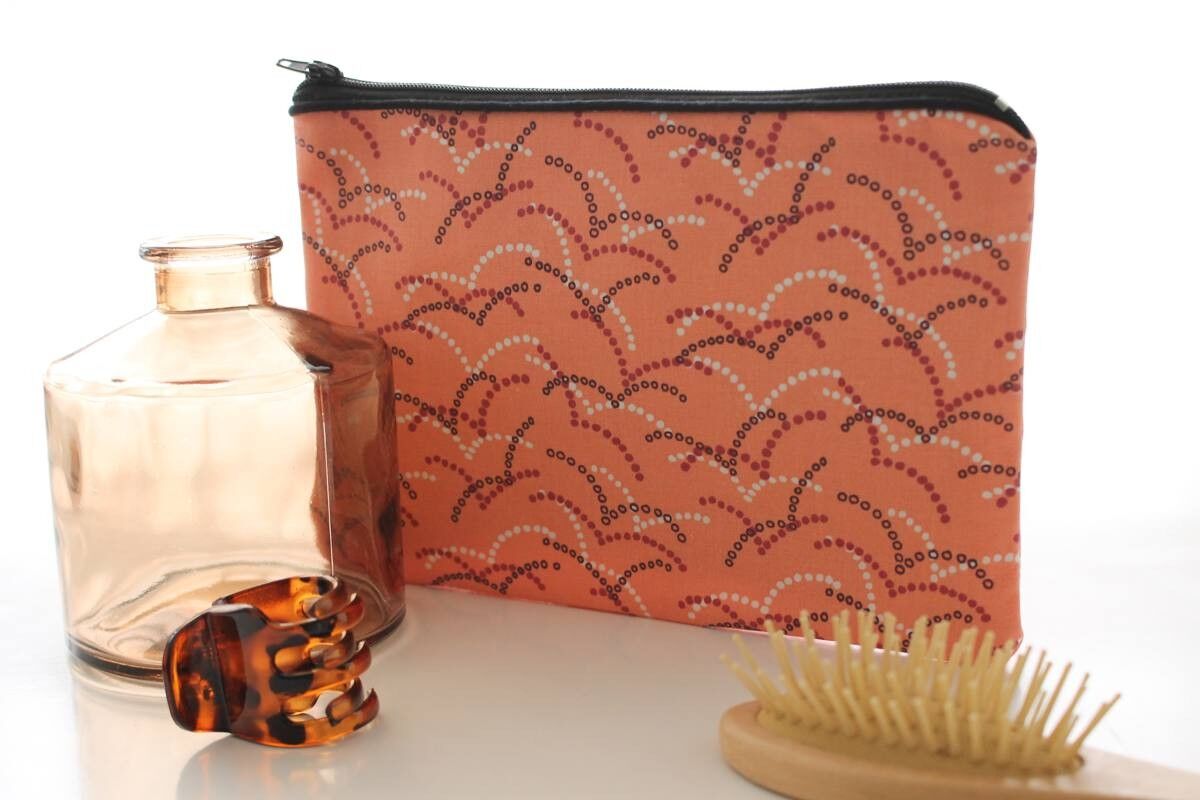 Pochette in corallo Alna con zip