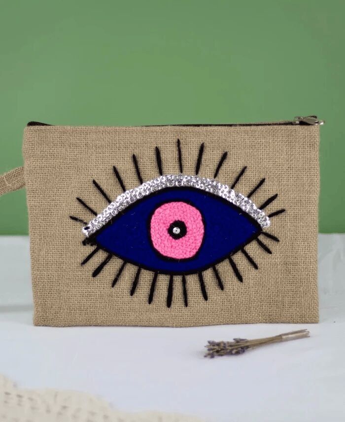 Pochette in juta con occhio di protezione - Design artigianale marocchino con occhio maligno