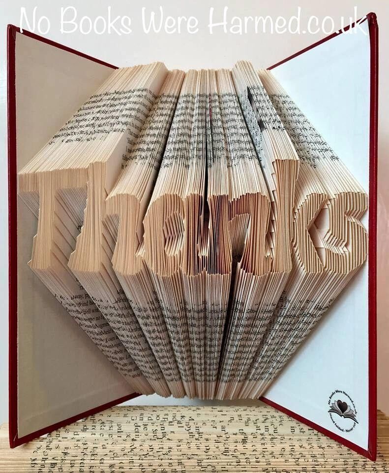 "Thanks" folded in to the pages of a book :