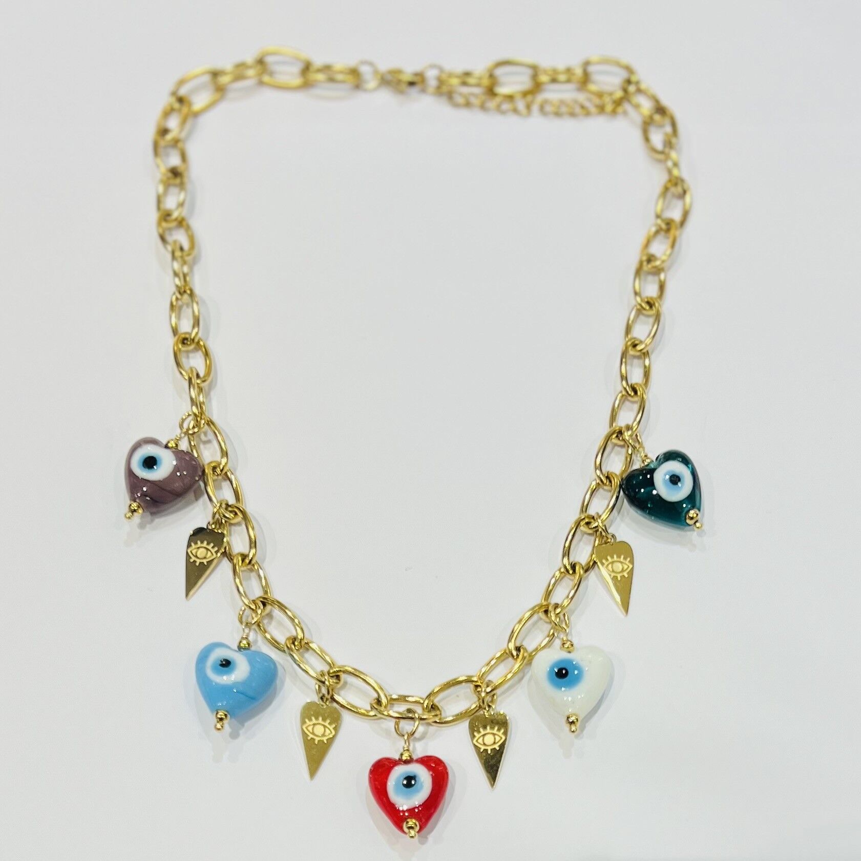 Collana in acciaio con pendenti a cuore multicolore, occhio greco dorato
