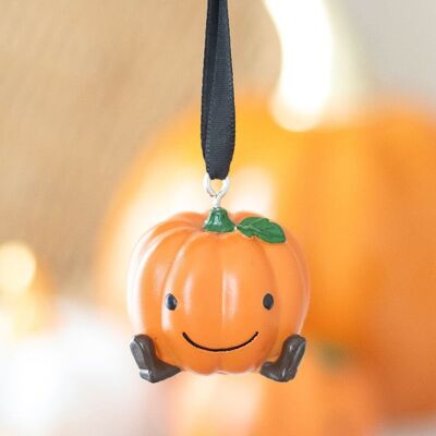 Lindo adorno colgante de calabaza sonriente