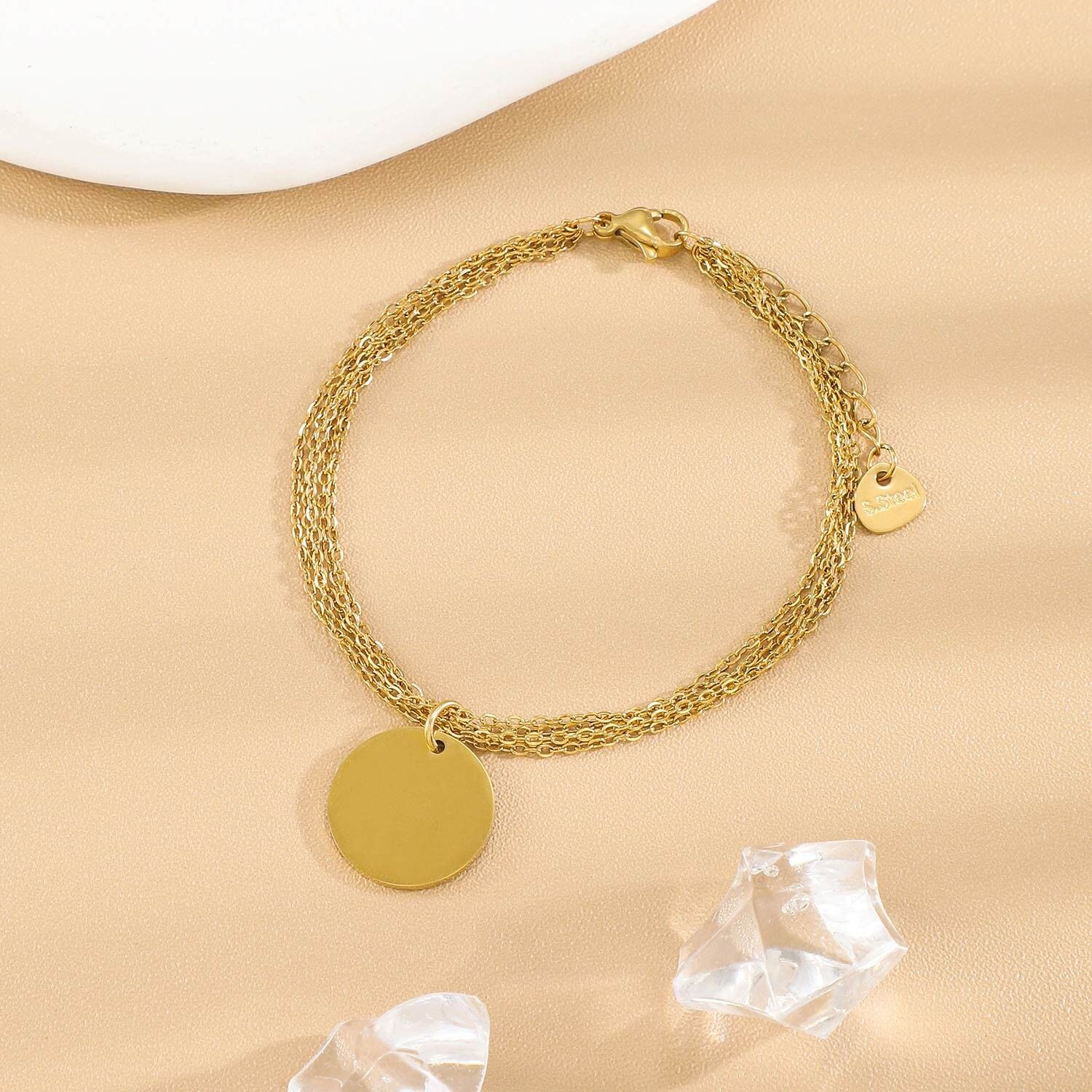 Bracciale in oro a catene intrecciate sottili, piastra rotonda da incidere