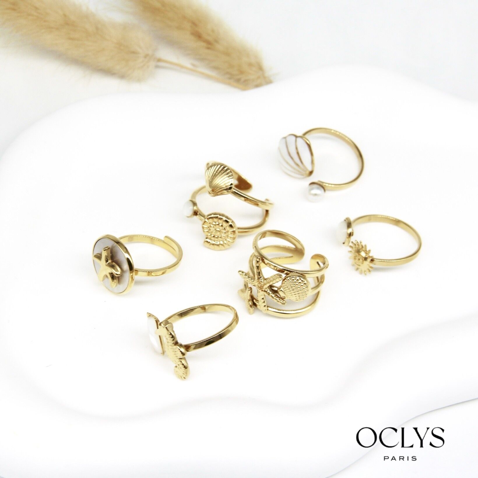 Lotto di 12 anelli tema mare in acciaio inox dorato Mibi