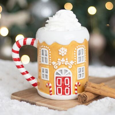 Taza con forma de casa de jengibre y bastón de caramelo