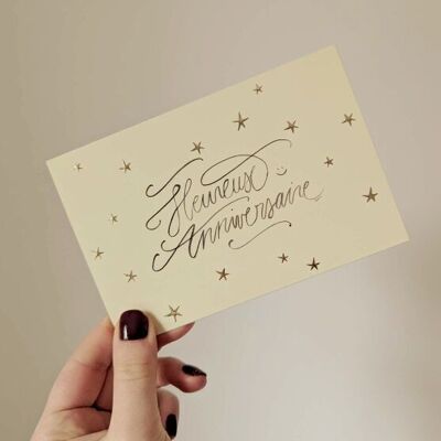 Tarjeta de feliz cumpleaños con estrellas doradas
