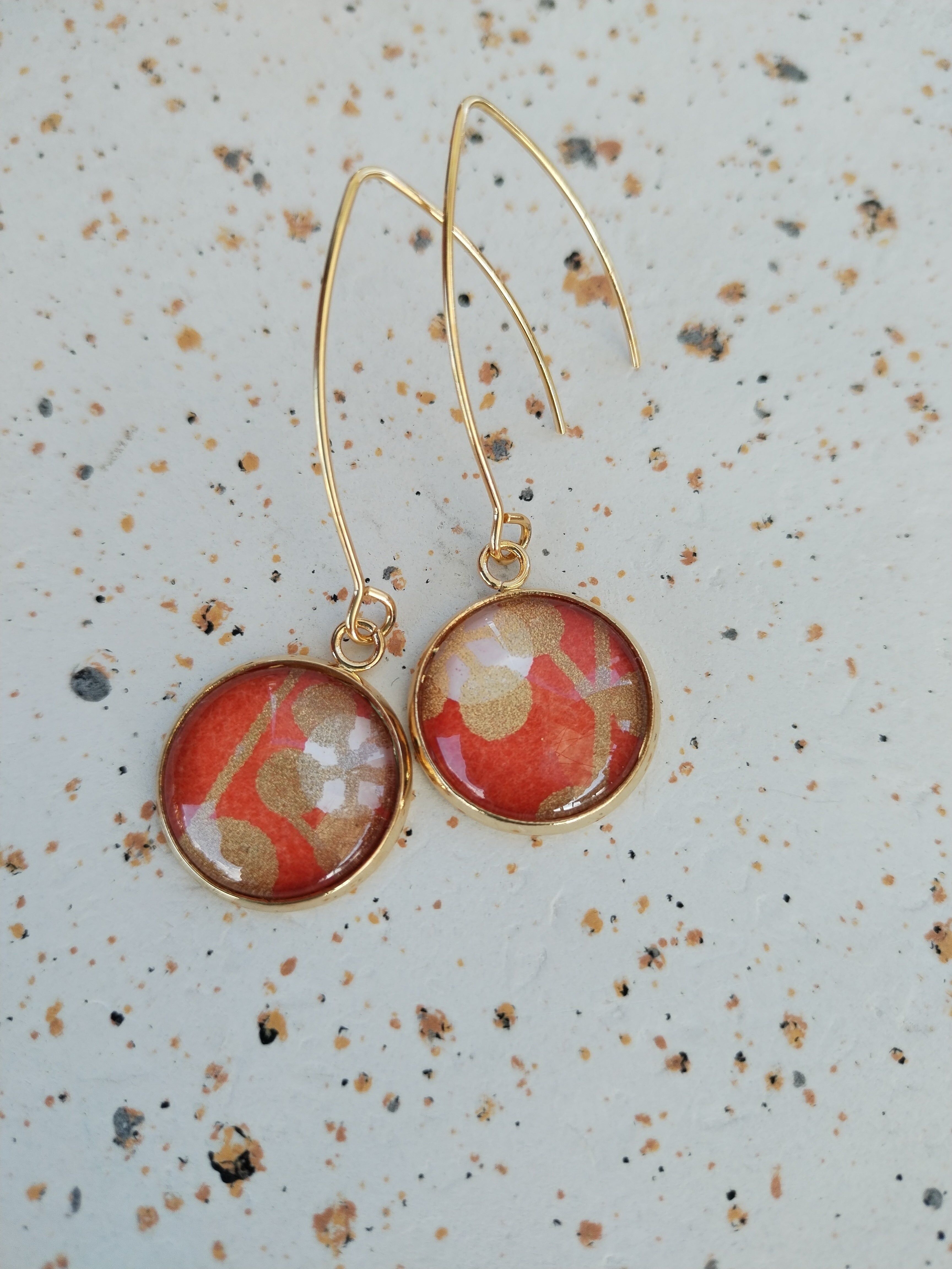 Orecchini lunghi arancioni e oro