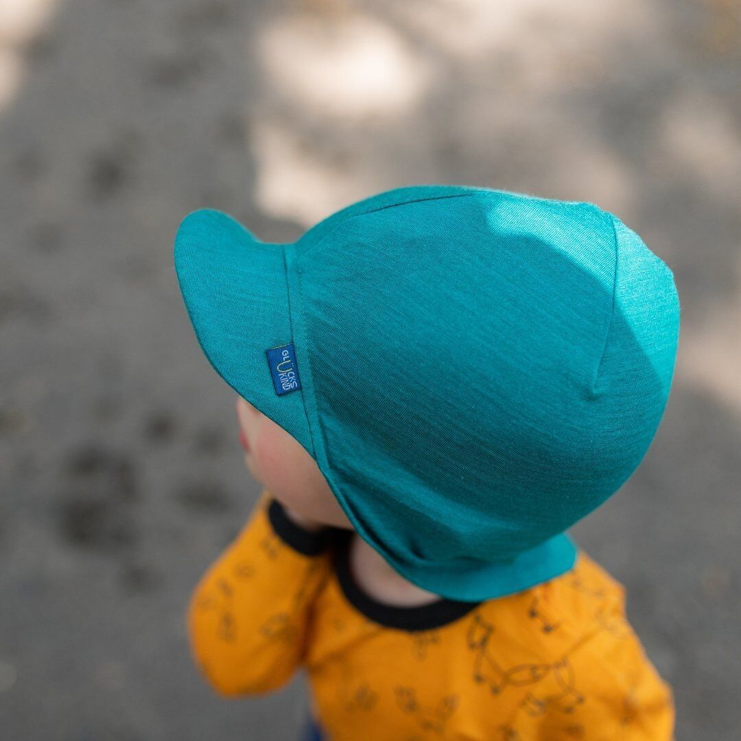Sonnenhut Junge aus bio Merinowolle & Seide in smaragd grün von Glückskind