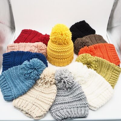 Knitted hat with pom pom