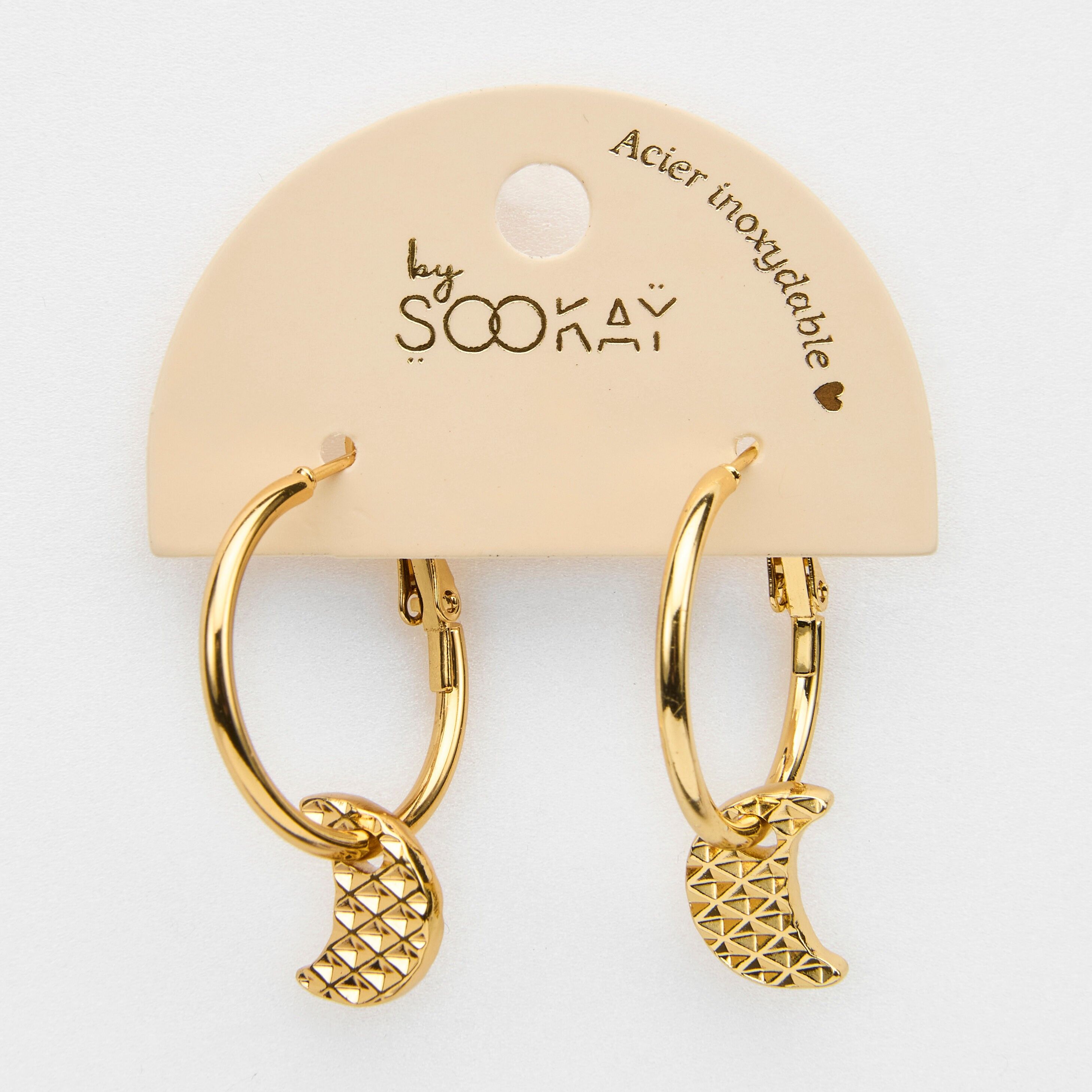 orecchini creoli in acciaio a forma di luna.