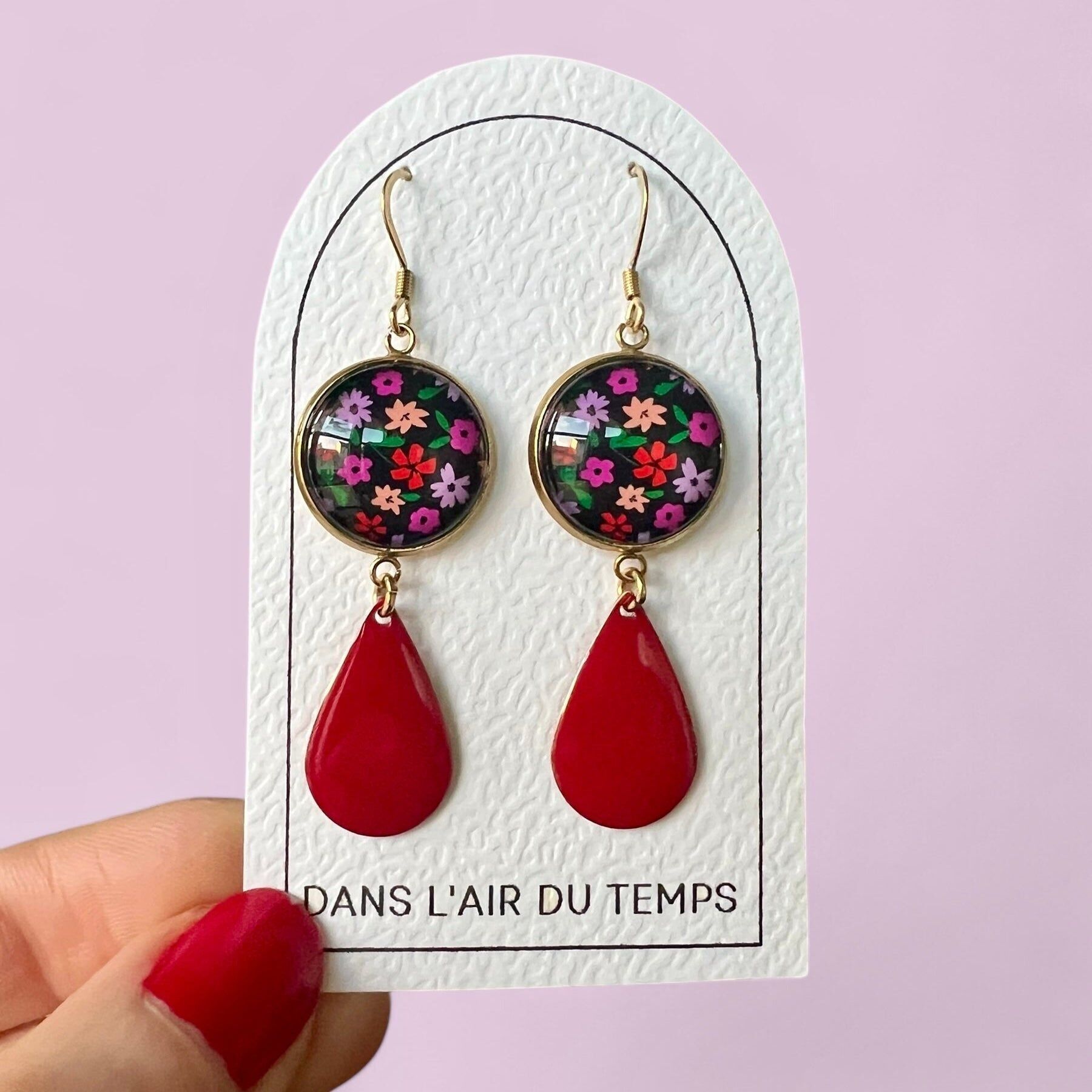 Dangling earrings with pink and red flowers on a black background, red enamel, gold or silver finish