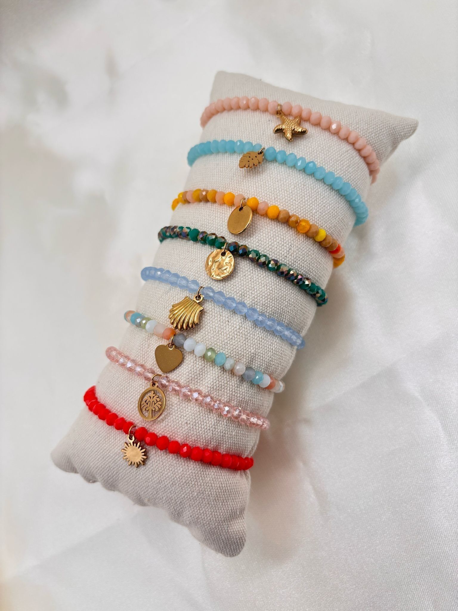 Set di 8 braccialetti elastici colorati arancioni e rosa