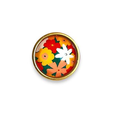 Anello con fiore multicolore su sfondo verde con finitura oro o argento