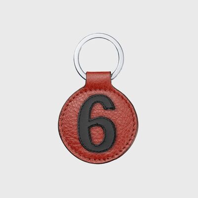 Portachiavi numero 6 in pelle nera con sfondo rosso
