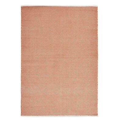 Alfombra Hug Rug tejida en espiga color óxido