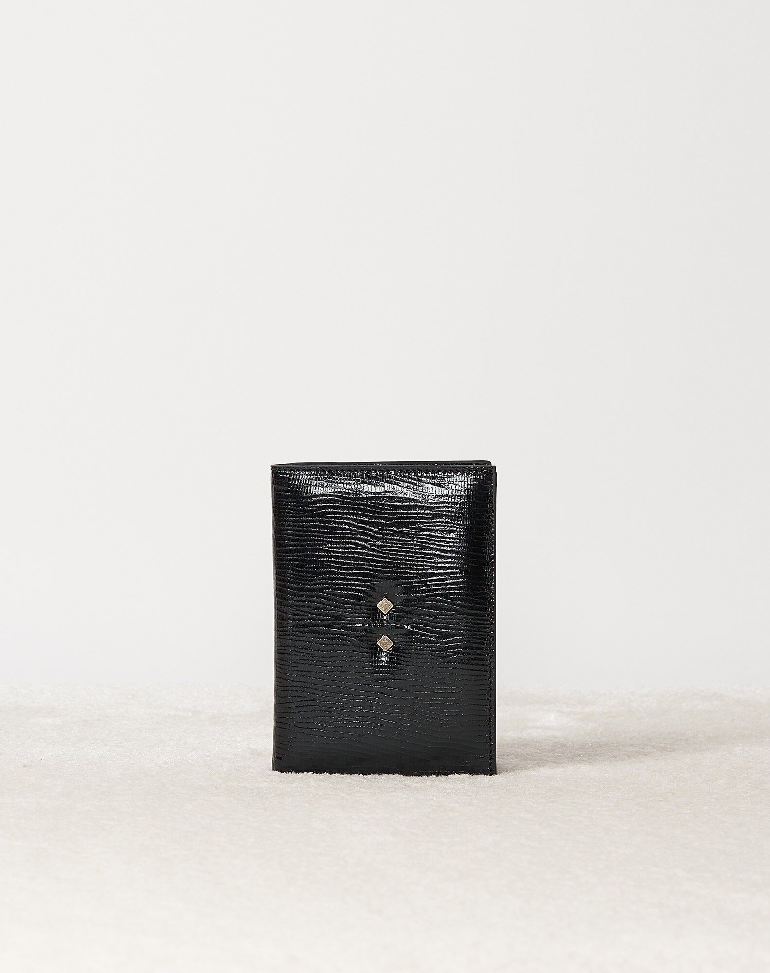 PORTAPASAPORTE ULYSSE DE CUERO NEGRO EN RELIEVE