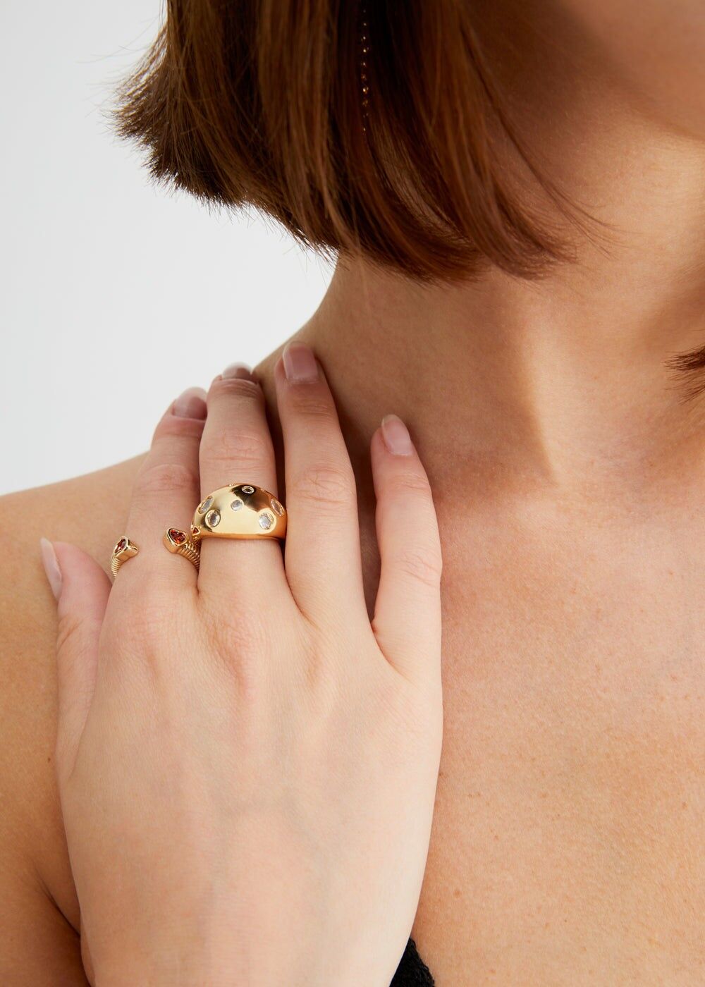 GOLD DOMED RING WITH WHITE STONES