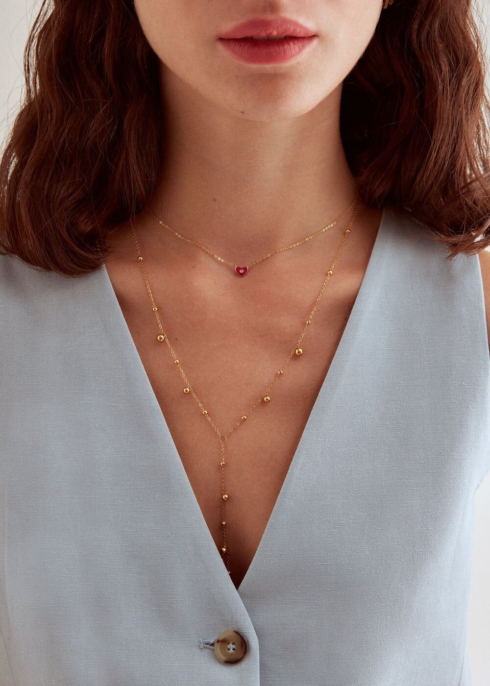 STAIN. STEEL NECKLACE IN GOLD WITH SPHERES