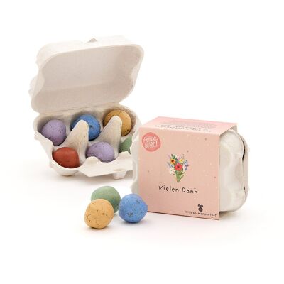 6 billes de fleurs colorées dans une boîte à œufs « Merci »