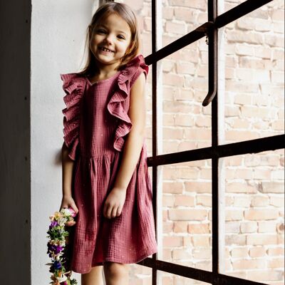 Vestido de muselina con volante y pequeña tapeta de botones