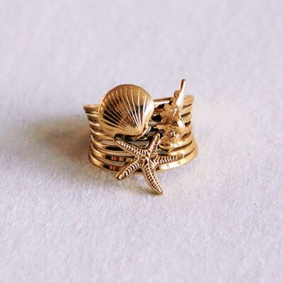 Anello a strati con stelle marine e conchiglie